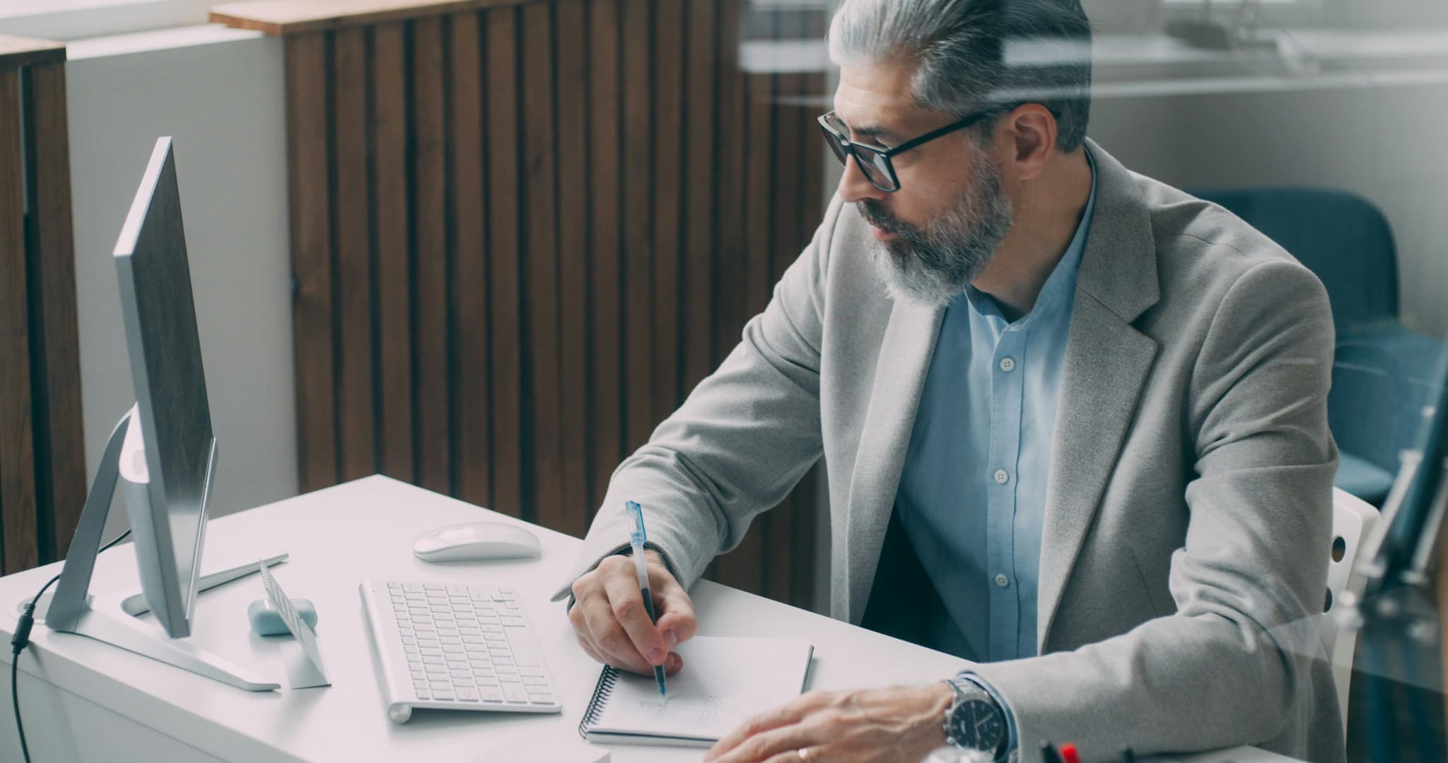 Two professionals reviewing business information