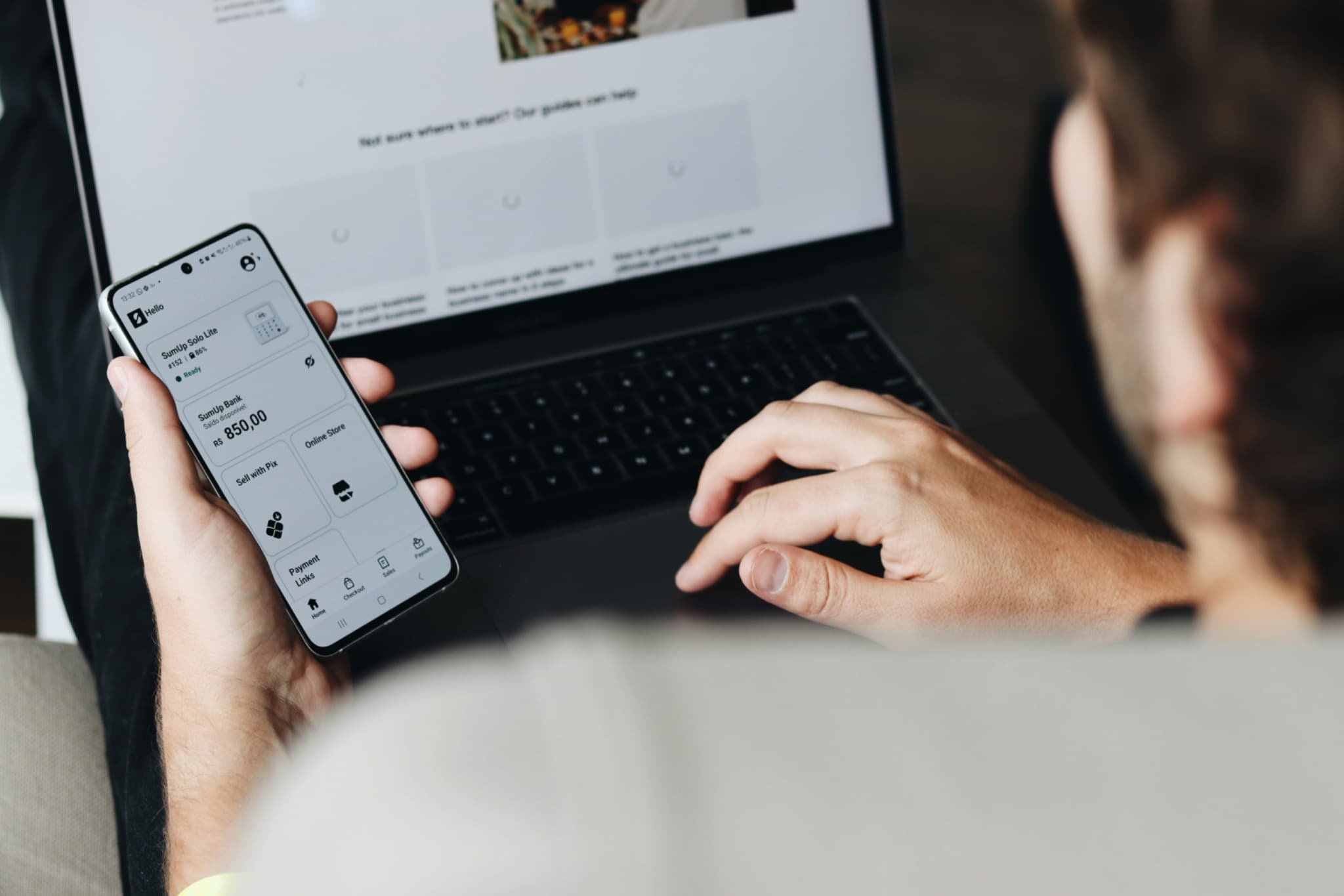 Digital financial workflow across laptop and smartphone